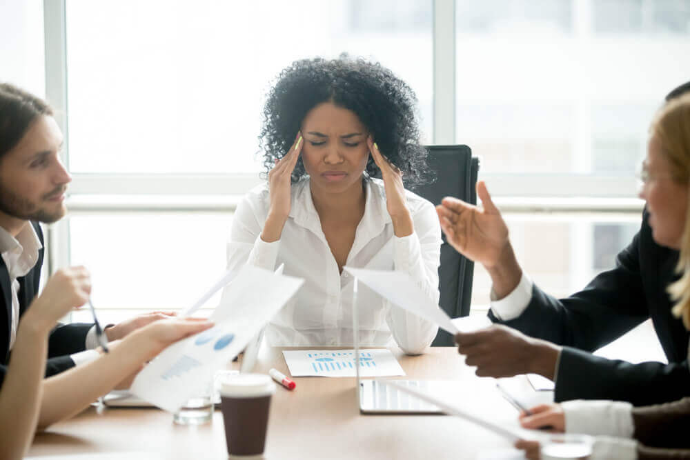 Woman stressed at meeting