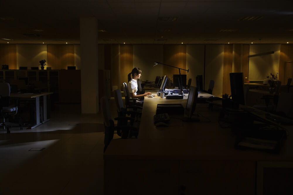 Woman working in office at night