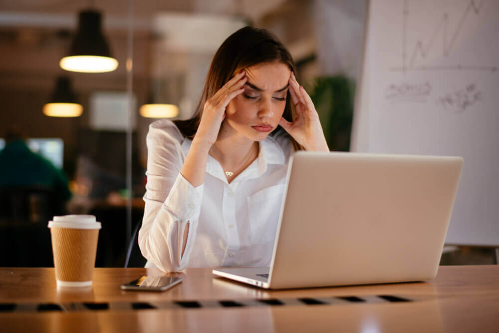 Woman stressed at office desk