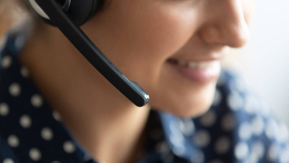 Close-up of woman on headset phone