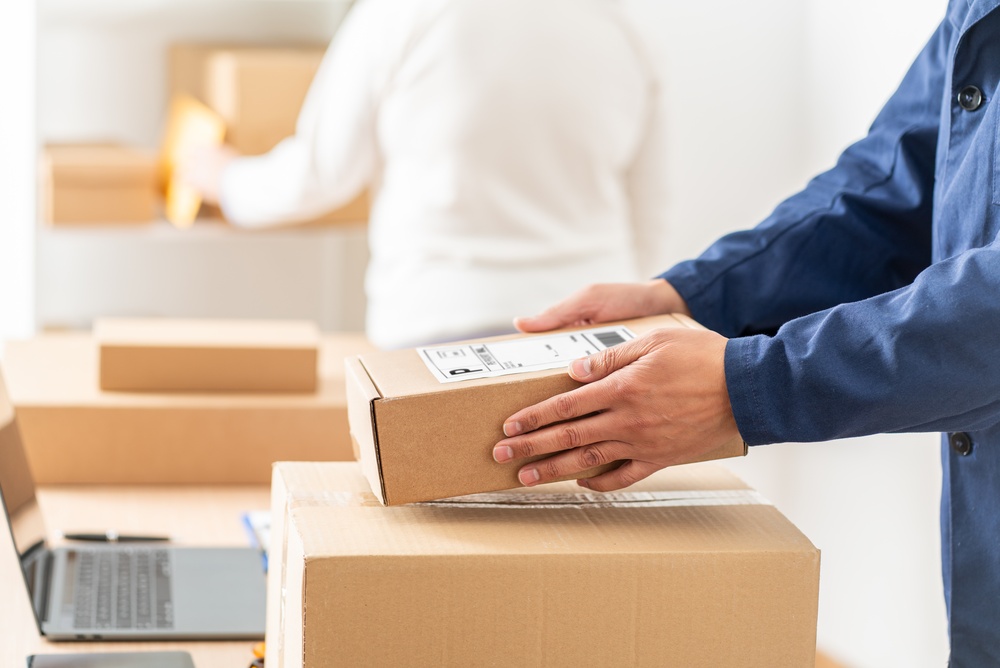 Man packing business orders