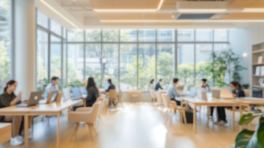 People in coworking space working around others