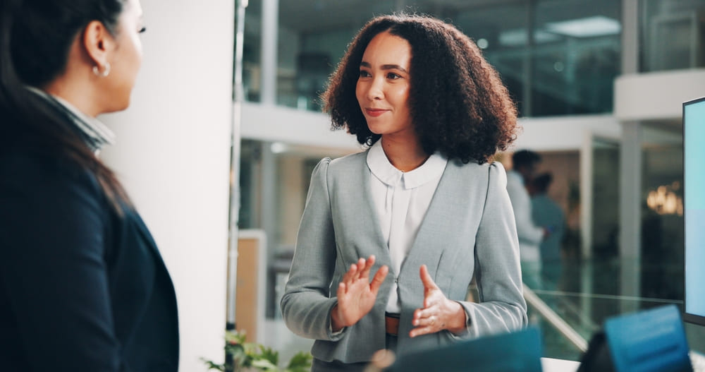 Professionals talking at coworking space