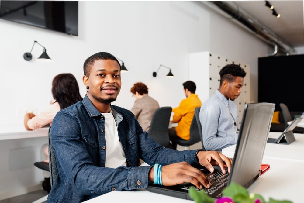 Man working at laptop in coworking space