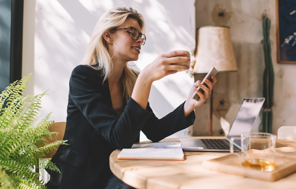 Woman running small business from desk