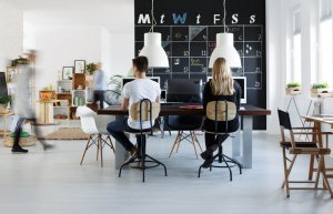Workers learning how to navigate a small business in a coworking space