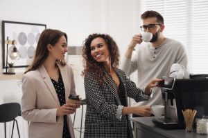 People micronetworking at coworking space while drinking coffee