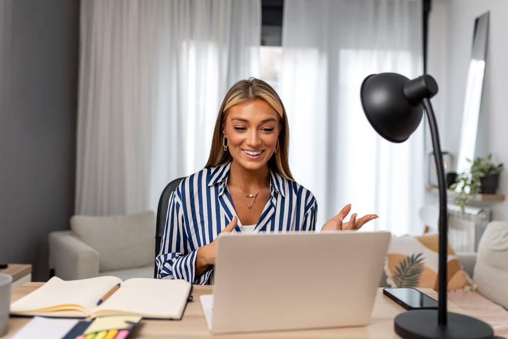 Happy and motivated professional woman on Zoom call