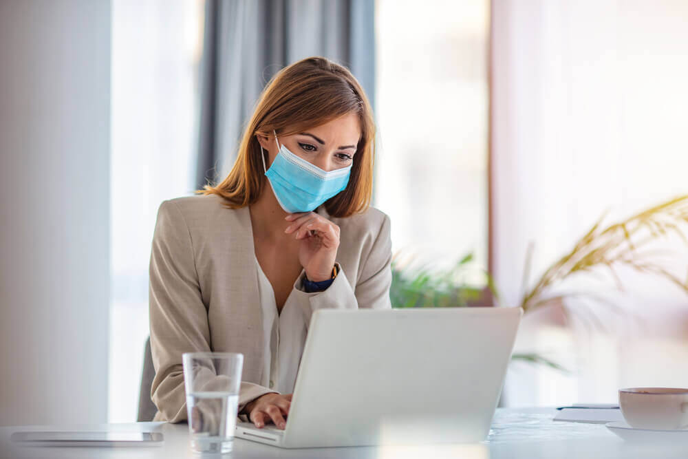 Woman wearing face mask at work