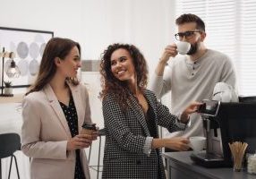 People micronetworking at coworking space while drinking coffee