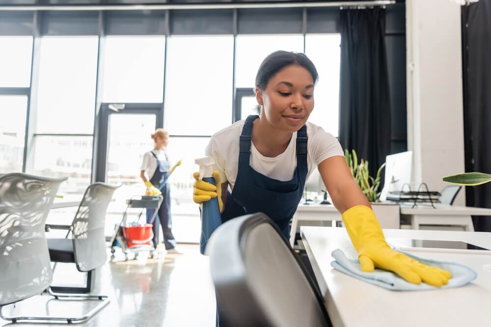 woman cleaning cowork space
